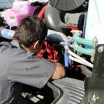 A JWCC Student learning to work on a diesel engine.