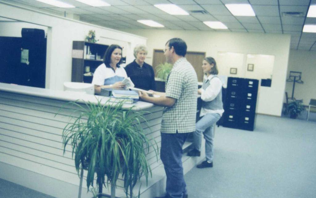 Early picture of the Pittsfield Education Center front desk